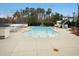 Community pool area featuring a kiddie pool, waterslide and covered seating areas at 3300 Magical Pl, Raleigh, NC 27614