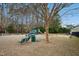 Community playground with benches, swings, and green space for to enjoy at 3300 Magical Pl, Raleigh, NC 27614