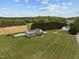 Large estate featuring a well-maintained house, inviting in-ground pool, and sprawling green lawn at 3646 Watkins Farm Rd, Hillsborough, NC 27278