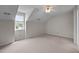 Bright bedroom featuring neutral carpet and a large window overlooking the trees outside at 3646 Watkins Farm Rd, Hillsborough, NC 27278