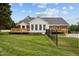 Back of house with large deck, screened-in porch and fenced yard, perfect for outdoor enjoyment at 3646 Watkins Farm Rd, Hillsborough, NC 27278