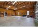 Spacious garage interior with exposed wood beams and ample storage space at 3646 Watkins Farm Rd, Hillsborough, NC 27278