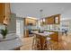 Bright, open kitchen featuring granite countertops, stainless steel appliances, and breakfast bar, perfect for modern living at 3646 Watkins Farm Rd, Hillsborough, NC 27278
