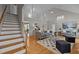 Inviting living room with high ceilings, hardwood floors, natural light, and an open layout, ideal for relaxation and entertaining at 3646 Watkins Farm Rd, Hillsborough, NC 27278
