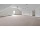 Large loft with neutral carpet and a view of closets and lighting at 3646 Watkins Farm Rd, Hillsborough, NC 27278
