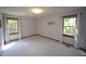 The bedroom features two windows and soft carpet flooring at 3813 W West Lake Rd, Apex, NC 27539