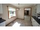 Dining area with tile flooring and natural light with a view to the backyard at 3813 W West Lake Rd, Apex, NC 27539