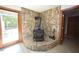 Unique fireplace with stone surround and wood-look floors at 3813 W West Lake Rd, Apex, NC 27539
