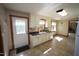 Bright kitchen area featuring white cabinets and tile flooring at 3813 W West Lake Rd, Apex, NC 27539