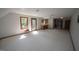 This spacious living room features two windows and carpet flooring at 3813 W West Lake Rd, Apex, NC 27539