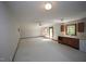 This spacious living room features two windows and carpet flooring at 3813 W West Lake Rd, Apex, NC 27539