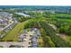 Beautiful aerial view of a residential community with a lake and lush green trees surrounding the homes at 408 Price Lake Way, Fuquay Varina, NC 27526