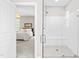 Bathroom featuring walk-in glass shower with white subway tile and a view into an adjacent bedroom at 408 Price Lake Way, Fuquay Varina, NC 27526
