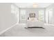 Calming bedroom with plush carpeting and plenty of natural light from the windows at 408 Price Lake Way, Fuquay Varina, NC 27526