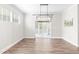 Bright dining room with sliding glass doors to the back patio at 408 Price Lake Way, Fuquay Varina, NC 27526