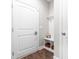 Cozy entryway with coat hooks, bench seating, and decorative storage baskets at 408 Price Lake Way, Fuquay Varina, NC 27526