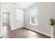 Bright entryway featuring light gray walls, wood-look flooring, and natural light from a window at 408 Price Lake Way, Fuquay Varina, NC 27526