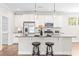 Modern kitchen featuring stainless steel appliances, granite countertops, and a spacious island at 408 Price Lake Way, Fuquay Varina, NC 27526