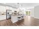 Modern kitchen featuring stainless steel appliances, granite countertops, and a breakfast bar area at 408 Price Lake Way, Fuquay Varina, NC 27526