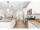 Modern kitchen featuring stainless steel appliances, granite countertops, and a gas range at 408 Price Lake Way, Fuquay Varina, NC 27526