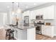 Modern kitchen featuring stainless steel appliances, granite countertops, and a spacious island at 408 Price Lake Way, Fuquay Varina, NC 27526