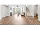 Bright living room boasts hardwood floors, a cozy fireplace, and large windows at 408 Price Lake Way, Fuquay Varina, NC 27526