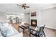 Open living room with modern furniture, fireplace, and hardwood floors at 408 Price Lake Way, Fuquay Varina, NC 27526