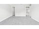 Expansive living room with neutral carpet and walls, featuring an open entryway and ample space at 408 Price Lake Way, Fuquay Varina, NC 27526