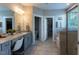 Bright bathroom featuring double sink vanity with granite countertop and large glass shower at 4424 Bonnie Loch Dr, Burlington, NC 27215