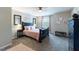 Bedroom featuring large bed with accent pillows, carpet flooring, and natural light from window at 4424 Bonnie Loch Dr, Burlington, NC 27215