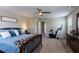 Cozy bedroom featuring a ceiling fan, stationary bike and a comfortable bed at 4424 Bonnie Loch Dr, Burlington, NC 27215