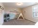 Bedroom with mountain wall art and a teepee play area at 4424 Bonnie Loch Dr, Burlington, NC 27215