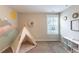 Carpeted bedroom features mountain wall art and a teepee play area at 4424 Bonnie Loch Dr, Burlington, NC 27215