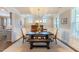 Bright dining room with a large table, comfortable seating, and ample natural light at 4424 Bonnie Loch Dr, Burlington, NC 27215