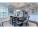 Elegant dining room with coffered ceiling, wainscoting, and stylish furnishings at 4424 Bonnie Loch Dr, Burlington, NC 27215