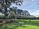 Sprawling home with multiple balconies overlooking a lush green lawn at 4424 Bonnie Loch Dr, Burlington, NC 27215