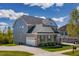 Well-maintained home featuring a two-car garage and ample driveway space at 4424 Bonnie Loch Dr, Burlington, NC 27215