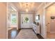 Elegant foyer featuring a tray ceiling, decorative lighting, and a front door with sidelights at 4424 Bonnie Loch Dr, Burlington, NC 27215