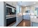Close-up view of the kitchen with stainless steel appliances and subway tile backsplash at 4424 Bonnie Loch Dr, Burlington, NC 27215