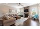 Cozy living room with a stone fireplace, comfortable seating, and natural light at 4424 Bonnie Loch Dr, Burlington, NC 27215