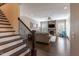 Inviting living room with a stone fireplace and staircase at 4424 Bonnie Loch Dr, Burlington, NC 27215