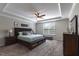 Serene main bedroom with tray ceiling, plush carpet, and a comfortable bed at 4424 Bonnie Loch Dr, Burlington, NC 27215