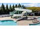 Community pool with a water slide providing fun for all ages in a lush green setting at 4424 Bonnie Loch Dr, Burlington, NC 27215