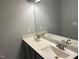 Bathroom featuring a long vanity with double sinks and modern fixtures at 48 Cullen Ct, Clayton, NC 27520