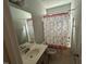 Bathroom features a shower/tub combo, a white vanity, and a mirror at 48 Cullen Ct, Clayton, NC 27520