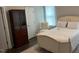 This bedroom features a vintage bed frame and dark wood floors at 48 Cullen Ct, Clayton, NC 27520