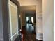 Inviting entryway with dark wood floors, storage, and clear sightlines to the dining area at 48 Cullen Ct, Clayton, NC 27520