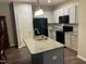 Modern kitchen with granite countertops, stainless steel appliances, and ample cabinet space at 48 Cullen Ct, Clayton, NC 27520