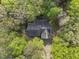 Aerial view of a house surrounded by green trees, providing privacy and a natural setting at 50 Beech Trl, Garner, NC 27529