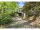 Secluded backyard featuring a deck, brick exterior, and lush greenery offering privacy at 50 Beech Trl, Garner, NC 27529